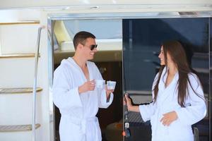 young couple on yacht photo