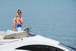 young couple on yacht photo