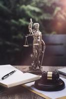 Business and lawyers discussing contract papers with brass scale on desk in office. Law, legal services, advice, justice and law concept picture with film grain effect photo