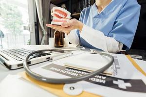 Medicine doctor and stethoscope touching icon medical network connection with modern interface on digital tablet in hospital background. Medical technology network concept photo
