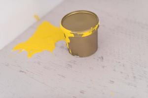 Yellow paint tin can photo
