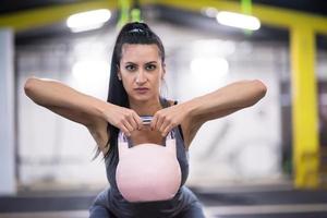 woman exercise with fitness kettlebell photo