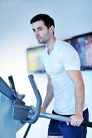 man running on the treadmill photo