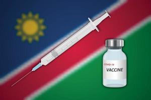 jeringa y vial de vacuna sobre fondo borroso con bandera de namibia, vector