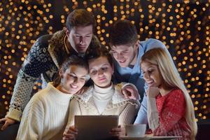 happy people looking at a tablet computer photo