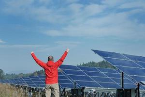 Male solar panel engineer at work place photo