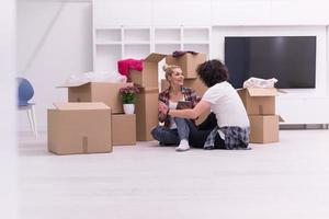 young couple moving  in new house photo