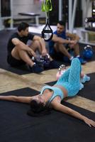 young athlete woman lying on the floor and relaxing photo