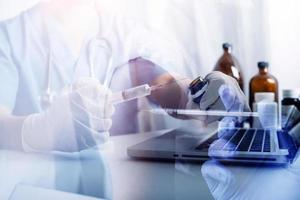 Medicine doctor and stethoscope touching icon medical network connection with modern interface on digital tablet in hospital background. Medical technology network concept photo