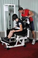 Young woman doing fitness in gym photo