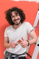 man with funny hair over color background with brush photo