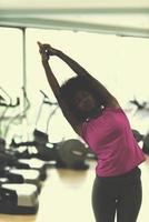 african american woman exercise yoga in gym photo