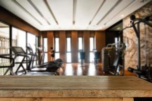 fitness gym and wooden table space in morning light photo