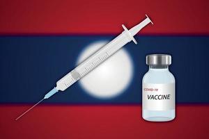 jeringa y vial de vacuna sobre fondo borroso con bandera de laos vector