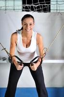 young woman practicing fitness and working out photo