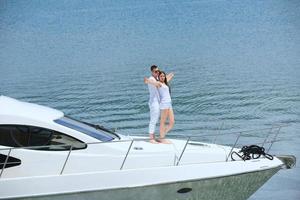 young couple on yacht photo