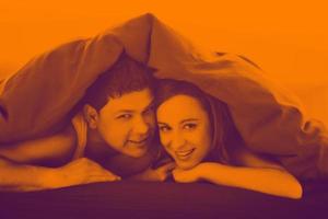 young couple in bed photo