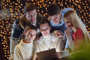 happy people looking at a tablet computer photo