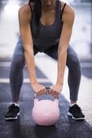 woman exercise with fitness kettlebell photo