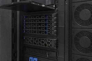 Data Center With Multiple Rows of Fully Operational Server Racks. Modern Telecommunications, Cloud Computing, Artificial Intelligence, Database, Supercomputer Technology Concept. photo