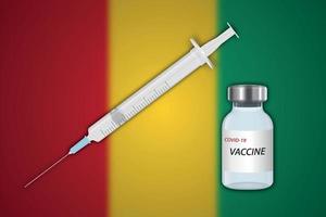 Syringe and vaccine vial on blur background with Guinea flag, vector