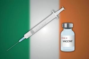 Syringe and vaccine vial on blur background with Ireland flag vector