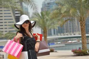 beautiful woman goes in shopping photo