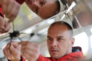 Male solar panel engineer at work place photo