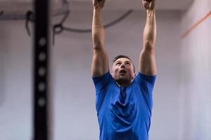 man doing dipping exercise photo