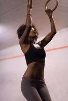 black woman doing dipping exercise photo