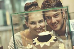 happy young couple in jewelry store photo