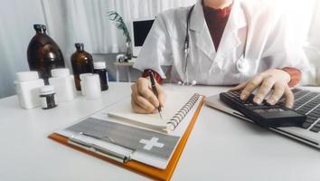 Medicine doctor and stethoscope touching icon medical network connection with modern interface on digital tablet in hospital background. Medical technology network concept photo