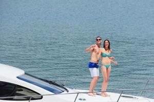 young couple on yacht photo