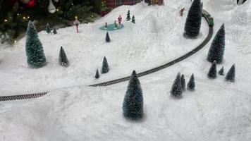 Electric train in the snow, christmas toy video