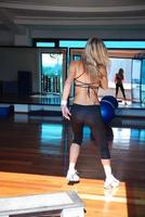 girl exercising in fitness studio photo