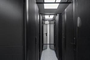 Data Center With Multiple Rows of Fully Operational Server Racks. Modern Telecommunications, Cloud Computing, Artificial Intelligence, Database, Supercomputer Technology Concept. photo