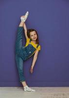 Cute little girl dancing at home photo