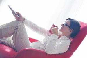 happy young woman relax at home on sofa photo