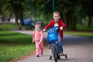 boy and girl with bicycle photo