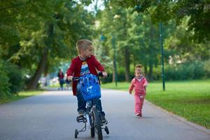 boy and girl with bicycle photo