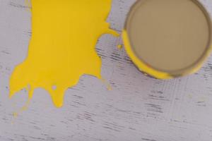 Yellow paint tin can photo