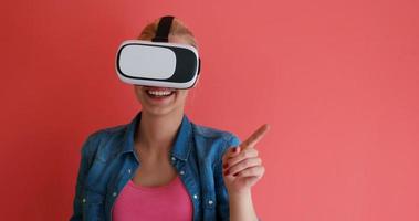 young girl using VR headset glasses of virtual reality photo