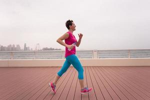 woman running on the promenade photo