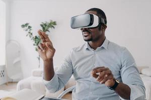 African american man developer in VR glasses use virtual reality modeling software. Future high tech photo