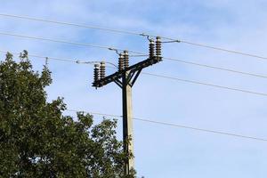 Electrical wires carrying high voltage current. photo