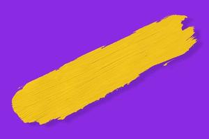 yellow brush and shadow isolated on a purple background photo