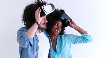 multiethnic couple getting experience using VR headset glasses