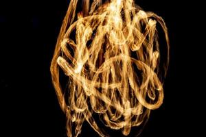 Line of fire in dark. Flame texture. photo