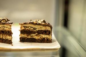 Sweetness on the counter. Cake with chocolate. Coffee treats. photo