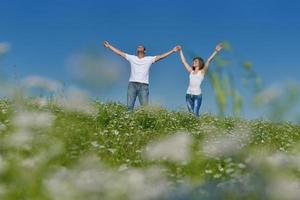 happy couple in wheat field photo